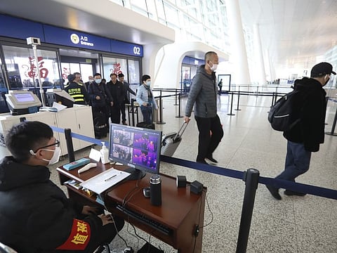 Passengers undergoing temperature scans at Wuhan Tianhe International Airport in Wuhan