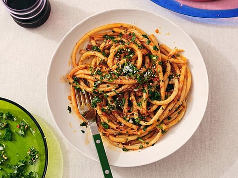 Alison Roman's caramelized shallot pasta, in New York, Jan. 7, 2020. The dish can be served with any pasta you please, but it’s shown here with perciatelli. Prop Stylist: Kalen Kaminski. (Michael Graydon & Nikole Herriott/The New York Times)