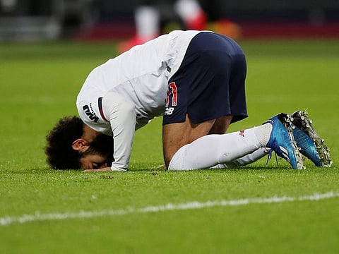 Liverpool's Mohamed Salah celebrates scoring their first goal.