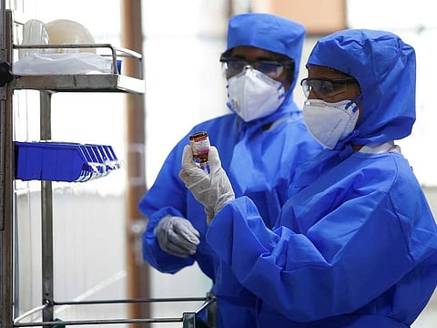 Medical staff with protective clothing are seen inside a ward specialised in receiving any person who may have been infected with coronavirus, at the Rajiv Ghandhi Government General hospital in Chennai, India.