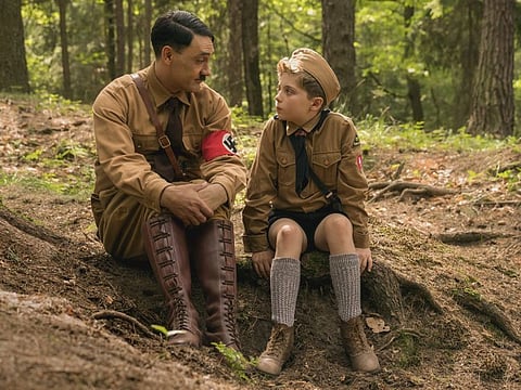 Taika Waititi and Roman Griffin Davis in the film JOJO RABBIT. Photo by Kimberley French. © 2019 Twentieth Century Fox Film Corporation All Rights Reserved