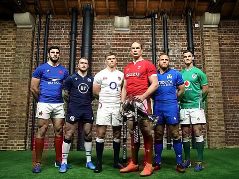 Team captains pose for a photo with the Six Nations Trophy, left to right, France's Charles Ollivon, Scotland's Stuart Hogg, England's Owen Farrell, Wales' Alun Wyn Jones, Italy's Luca Bigi and Ireland's Jonathan Sexton during the Six Nations launch.