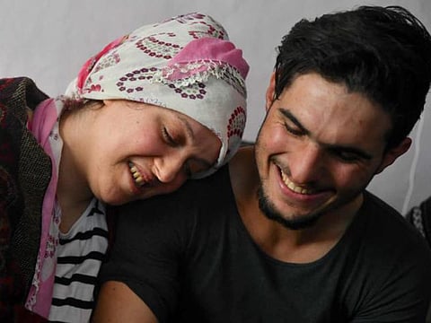 A picture of Mahmoud with Turkish woman he rescued