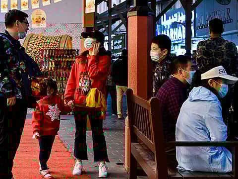 People wearing masks at the Gold Souq in Dubai