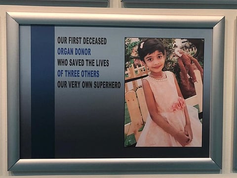 The photo of young kidney donor Dervisiri Tavva on the wall of fame at Shaikh Khalifa Medical City