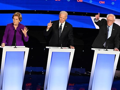 Democratic presidential hopefuls Massachusetts Senator Elizabeth Warren (left), former vice-president Joe Biden (centre) and Vermont Senator Bernie Sanders participate in the seventh Democratic primary debate of the 2020 presidential campaign season in Des Moines, Iowa.