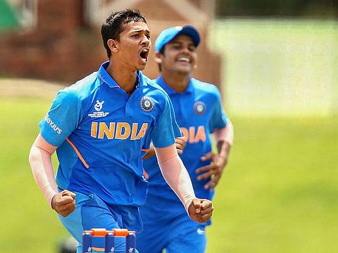 Yashasvi Jaiswal of India celebrates taking the wicket of Haider Ali of Pakistan