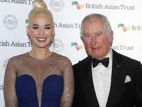 Britain's Prince of Wales, Royal Founding Patron, the British Asian Trust, meets musician Katy Perry, left, as he arrives to attend a reception for supporters of the British Asian Trust in London, Tuesday, Feb. 4, 2020.