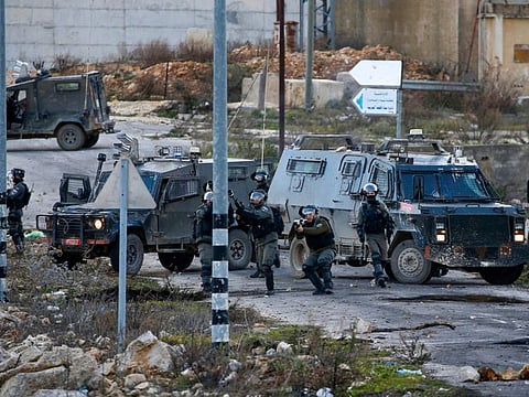 Israeli security forces gather during clashes with Palestinian demonstrators following a rally protesting a US peace plan proposal, at the northern entrance of the West Bank city of Ramallah on February 1, 2020.