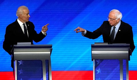Former Vice-President Joe Biden and Senator Bernie Sanders debate at the Democratic 2020 US presidential candidates debate in Manchester, New Hampshire, on February 7.