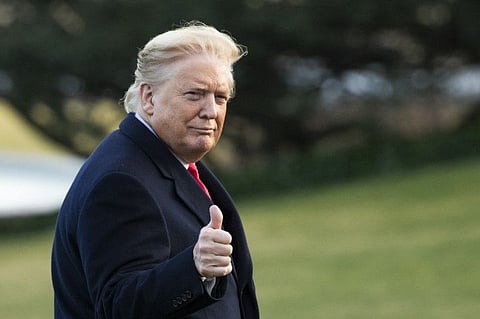 President Donald Trump gestures as he arrives back to the White House on February 7, 2020, in Washington, from a trip in Charlotte, North Carolina.