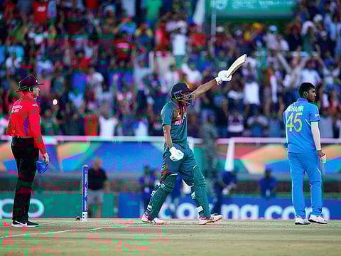 Bangladesh's Rakibul Hasan (C) celebrates after scoring the winning runs as India's Atharva Ankolekar and umpire Sam Nogajski (L) looks on at during the ICC Under-19 World Cup cricket finals at the Senwes Park, in Potchefstroom, on February 9, 2020.