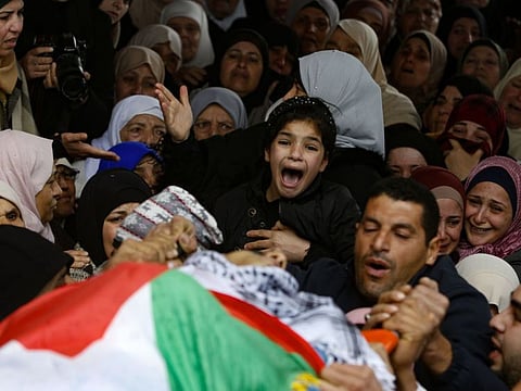 The young sister of Badr Nafla, 19, who was shot dead by the Israeli occupation regime near the northern West Bank city of Tulkarem yesterday, reacts during his funeral in the same city on Saturday.