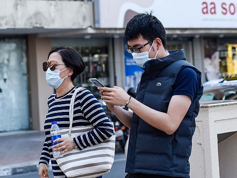 Tourists wearing masks in Bur Dubai