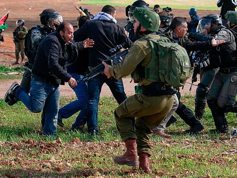 Palestinian protesters clash with Israeli soldiers during a demonstration against a US brokered Middle East peace deal near the West Bank village of Tamun near the Jordan Valley on January 31, 2020.