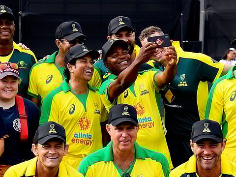 Sachin Tendulkar smiles for a selfie with Brian Lara