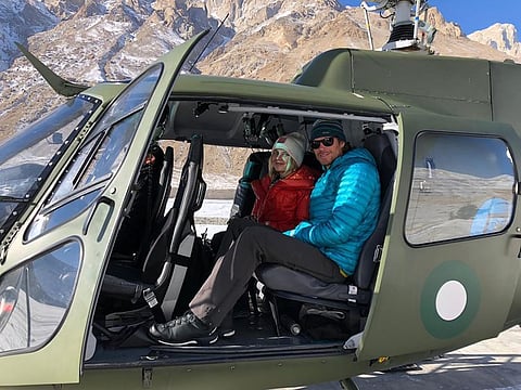 Rescued mountaineers Donald Allen Bowie from Canada and Lotta Henriikka Nakyva from Finland sit in a helicopter after being rescued by the Pakistan Army from Broad Peak, Baltoro Glacier in Pakistan on February 9, 2020.