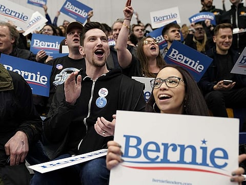 Democratic presidential candidate Bernie Sanders' supporters watch early results come in at Sanders' New Hampshire primary night event on February 11, 2020 in Manchester, New Hampshire.