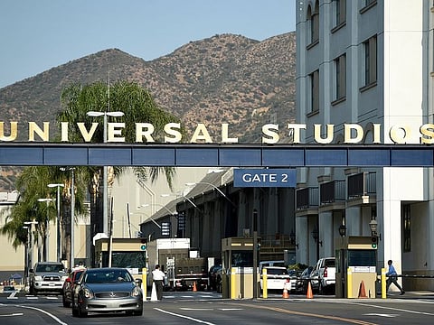 the entrance to the Universal Studios lot is pictured in Universal City, Calif. A film built around the premise of liberal “elites” hunting people for sport in red states is coming to theaters in March, and the studio behind it is leaning into controversy about its premise.