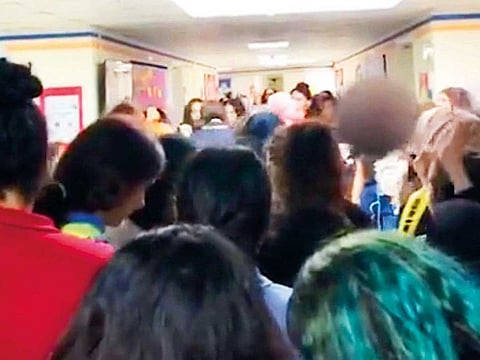 A video grab of students demanding that the school officials release their friends.