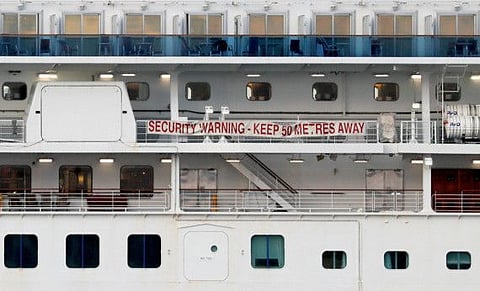 A banner is seen on the cruise ship Diamond Princess at Daikoku Pier Cruise Terminal in Yokohama, Tuesday.