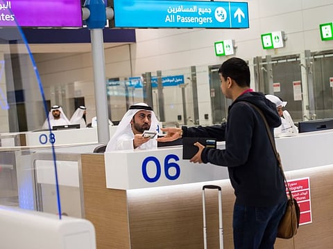 Passengers going through the passport control at Dubai International airport terminal 3