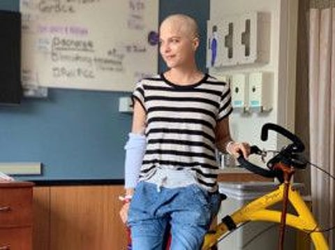 Actor Selma Blair, who has battled multiple sclerosis (MS), poses with an Alinker 'walking bike', a mobility device for people with disabilities, in an unknown location in this undated handout photo.