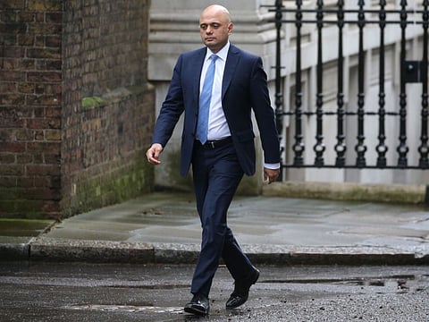 Britain's Chancellor of the Exchequer Sajid Javid walks at 10 Downing Street in central London on February 13.