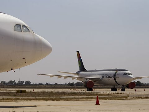 In this file photo, airplanes are parked in the tarmac of the international airport in Tripoli, Libya. The only functioning airport in Libya's capital suspended its operations after coming under attack on January 22.