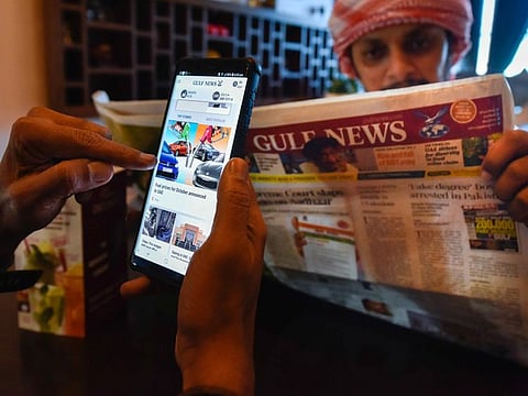 People reading Gulf News at a cafe in Sharjah. Photo: Ahmed Ramzan/ Gulf News