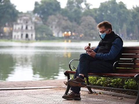 A man wears a protective mask in Hanoi