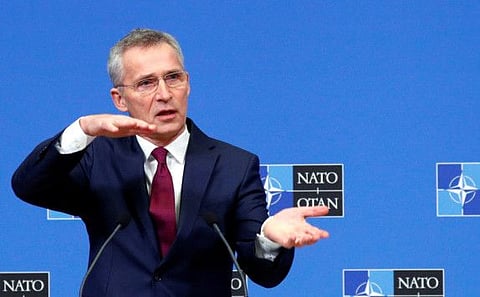 Nato Secretary General Jens Stoltenberg gestures during a news conference in Brussels on February 11.