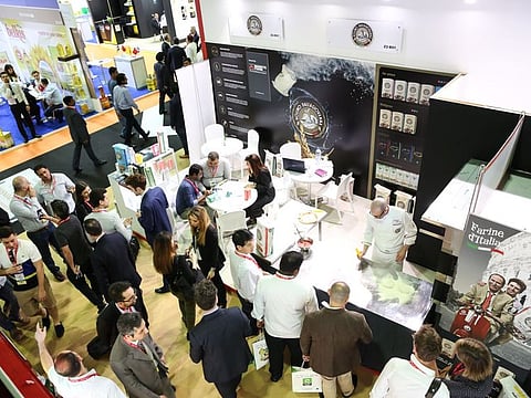 Visitors examine wares at a pavilion during a previous edition of Gulfood