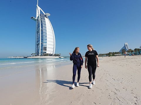 Sofia Kenin and Kim Clijsters chat on the beach