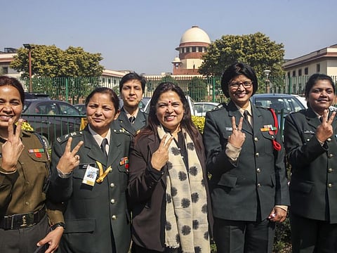 BJP MP and noted lawyer Meenakshi Lekhi flashes the victory sign along with some of the Short Service Commission women officers outside the Supreme Court in New Delhi on Monday. The apex court on Monday ruled that women officers should get Permanent Commission in the Army.