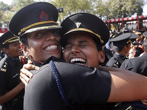 Women cadets celebrate after their graduation ceremony at the Indian Army's Officers Training Academy in Chennai on March 14, 2015.