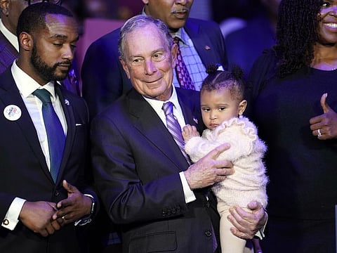 Democratic presidential candidate and former New York City Mayor Michael Bloomberg is joined on stage by supporters during his campaign launch of "Mike for Black America," at the Buffalo Soldiers National Museum on February 13 in Houston.