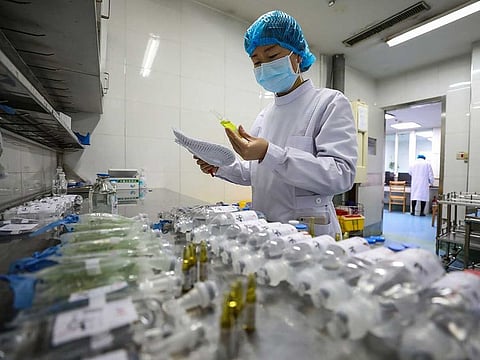 A nurse prepares medicines for patients at Jinyintan Hospital designated for new coronavirus infected patients, in Wuhan in central China's Hubei province.