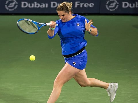 Kim Clijsters during her first round action against Garbine Muguruza in Dubai on Monday.