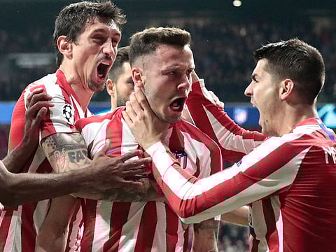 Atletico Madrid's Saul, second from right, celebrates after scoring his side's goal against Liverpool