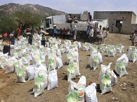 In this  file photo, men deliver aid donations from donors, in Aslam, Hajjah, Yemen. Al Houthis in Yemen have blocked half of the United Nations’ aid delivery programmes in the war-torn country.