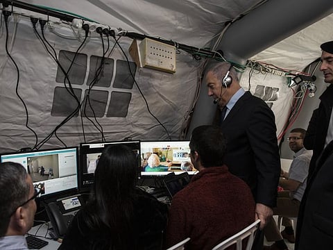 Israeli Prime Minister Benjamin Netanyahu visits an observation tent at the Chaim Sheba Medical Centre at Tel Hashomer for discussions about the Coronavirus, in Ramat Gan, Israel, Wednesday.