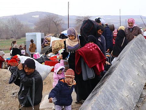 Displaced Syrians who fled the military offensive in Idlib province arrive in Manbij, north Syria