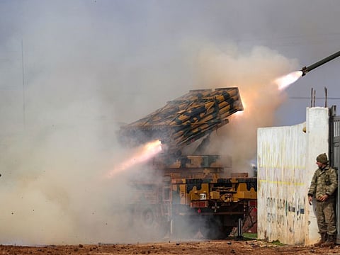 A Turkish military mobile rocket launcher fires from a position in the countryside of the Syrian province of Idlib towards Syrian government forces' positions in the countryside of neighbouring Aleppo province on February 14, 2020.