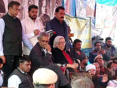 Senior Supreme Court lawyers Sadhana Ramachandran and Sanjay Hegde address demonstrators who have been protesting against CAA for over two months, at Shaheen Bagh, in New Delhi on Wednesday.