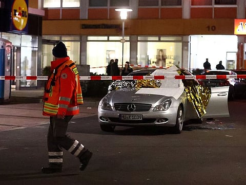 A damaged car is seen after a shooting in Hanau near Frankfurt, Germany, February 20, 2020.