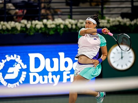 Ons Jabeur in action against Simona Halep