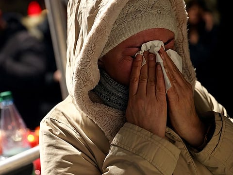 A mourner reacts during a vigil for the victims of a shooting in Hanau, near Frankfurt, Germany, February 20, 2020.