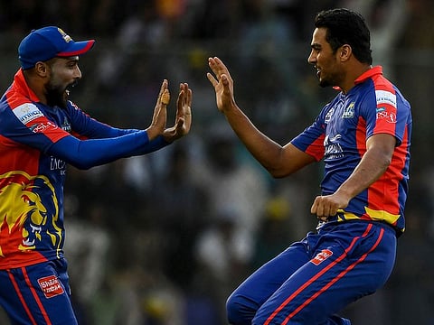 Karachi Kings' Arshad Iqbal and Mohammad Amir celebrate after the dismissal of Peshawar Zalmi's Shoaib Malik