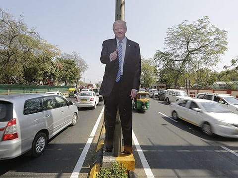 A life size cut-out of US president Donald Trump stands on a road divider, ahead of his visit in Ahmedabad Saturday.